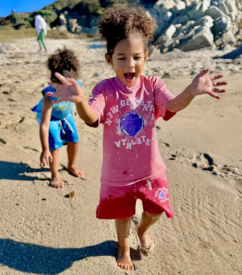 Child in pink athletic wear.